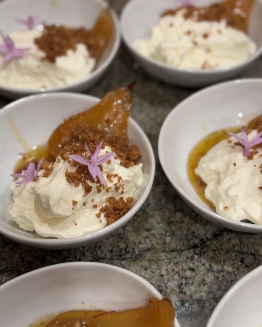 Poached pears with cream and crumble